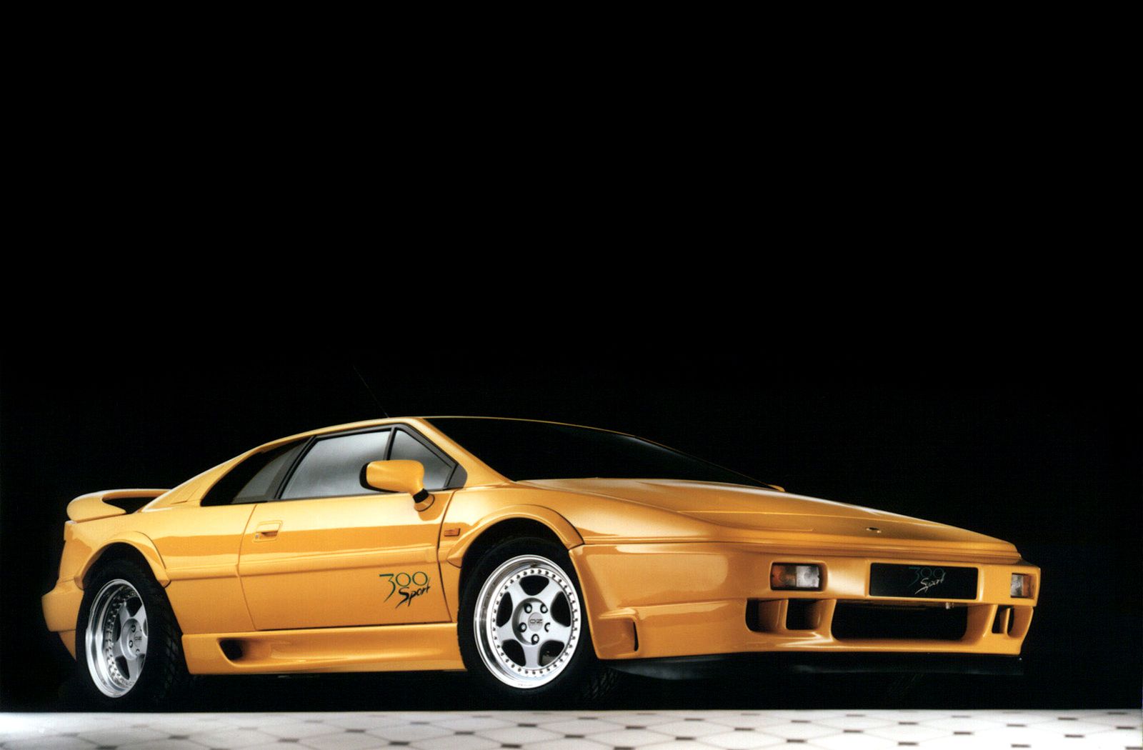 The Sport 300 as Lotus photographed it for the press: OZ split-rim wheels, extended wheel-arches, a body-mounted rear aerofoil, and the front airdam …